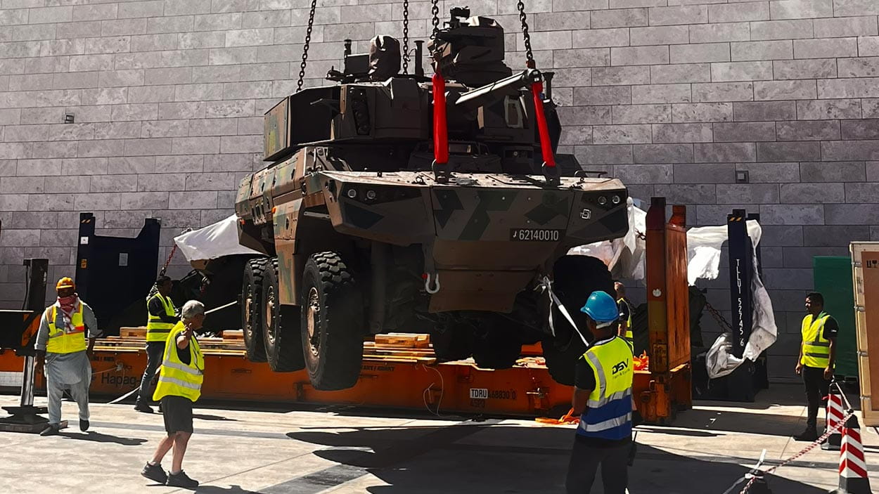 A group assembling dismantling exhibits and transporting stuff back.